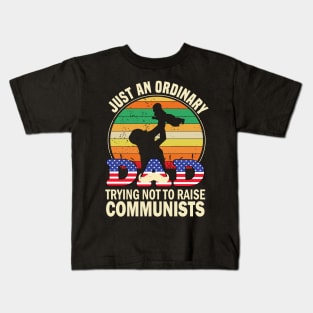 Just an ordinary dad trying not to raise communists.. Kids T-Shirt